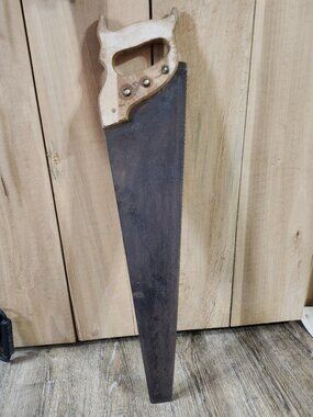 vintage wooden handle saw